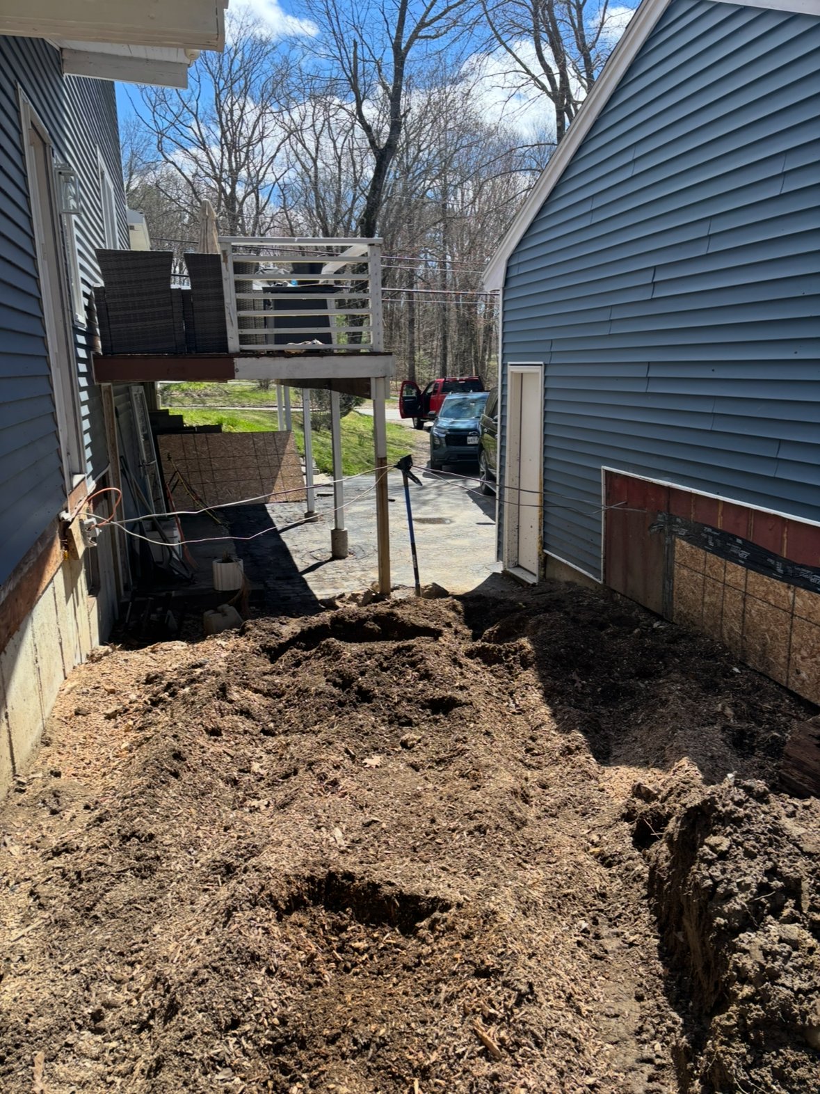 Same tight side yard after grinding, ground flush and cleared